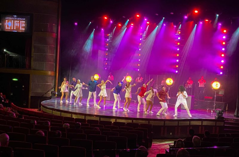 Guests gather to watch the stage production of “Life” on Celebrity Equinox.