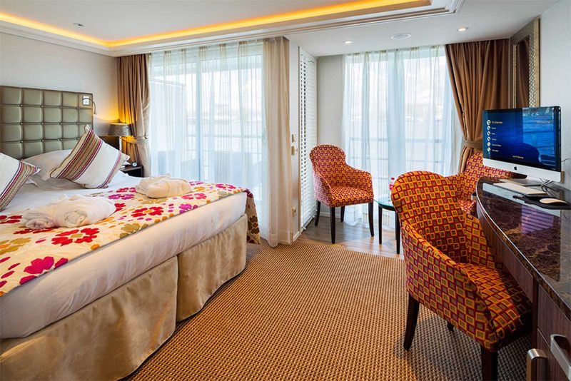 Rest in your stateroom after a day of exploring charming villages and historic outposts along the Danube on your AmaStella sailing. 
