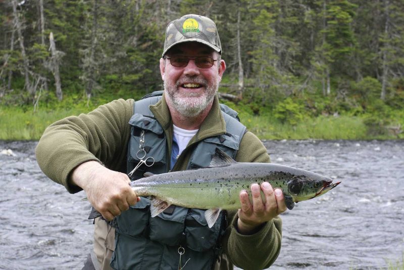 A local fisherman shows off the brook trout he caught on the Avalon Peninsula in Newfoundland.