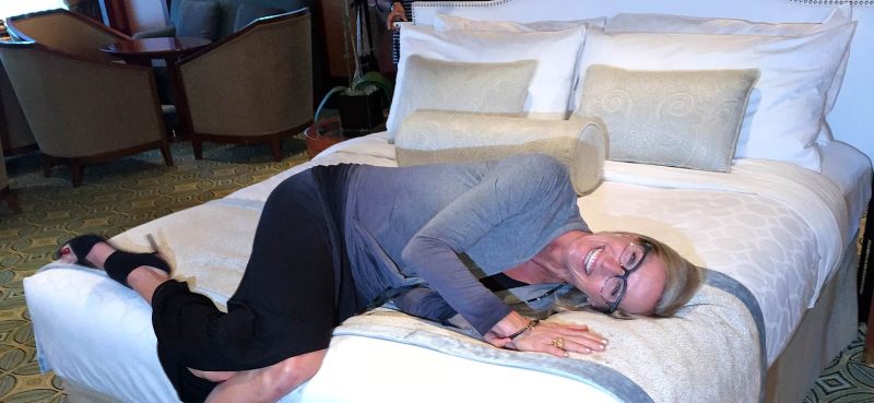 Designer Candice Olson of HGTV shows off one of the 44,000 new beds being introduced on Princess ships.