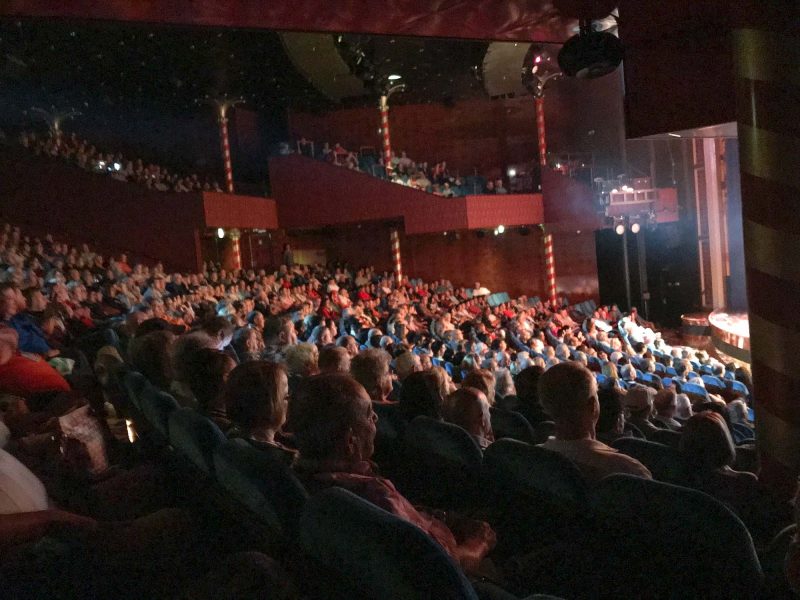 Audience members watch a performance at the Stardust Theater aboard Norwegian Jade. 