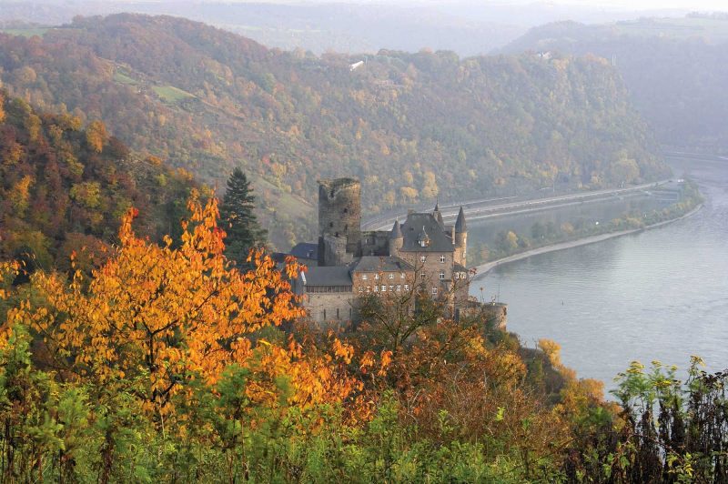 Katz Castle, above the town of St. Goarshausen, Germany, in autumn. The castle was built around 1371 and is now privately owned.