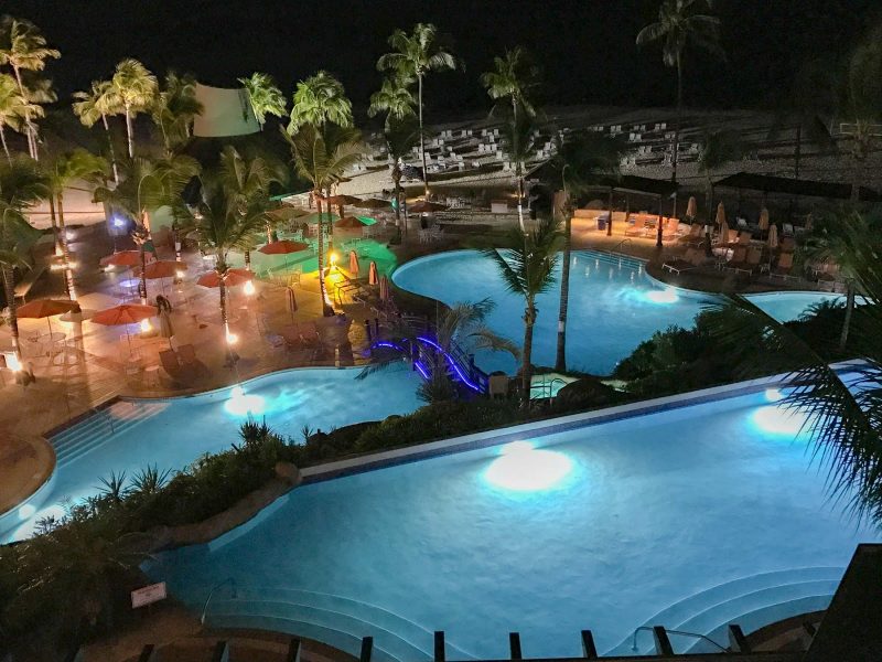 The illuminated pool of the Hilton Barbados Resort at night. 