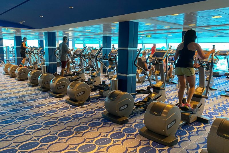 Guests work out in the Fitness Center on Celebrity Equinox.