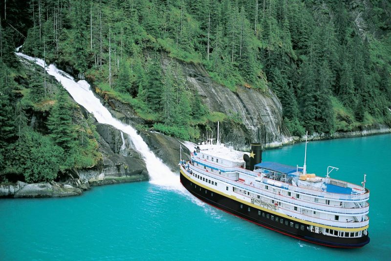 The 88-passenger S.S. Legacy stops by a waterfall in southeastern Alaska.