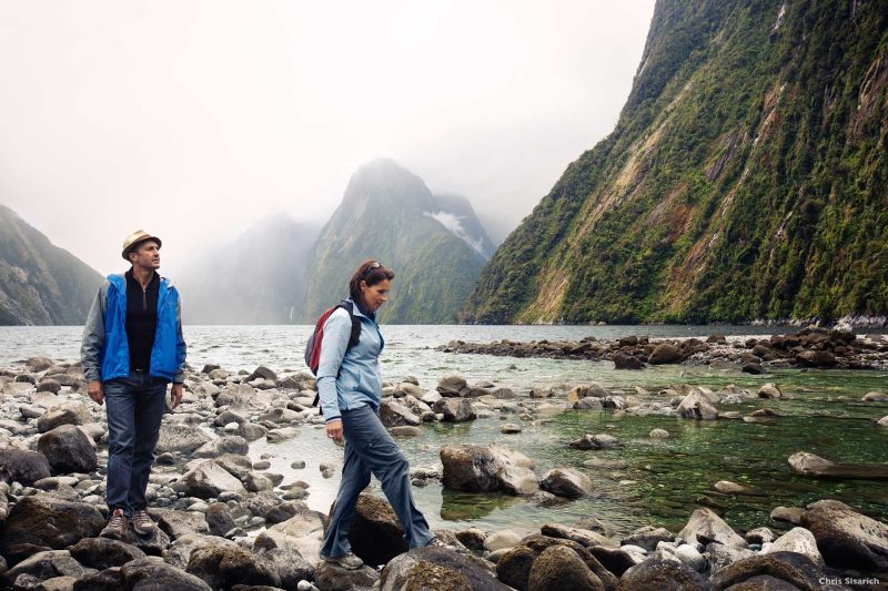 There’s a prehistoric feel to Milford Sound. The steep cliffs, carved by an ancient glacier, are draped in native forest and ferns. High waterfalls plummet from river valleys, creating streaks of white amid the green.