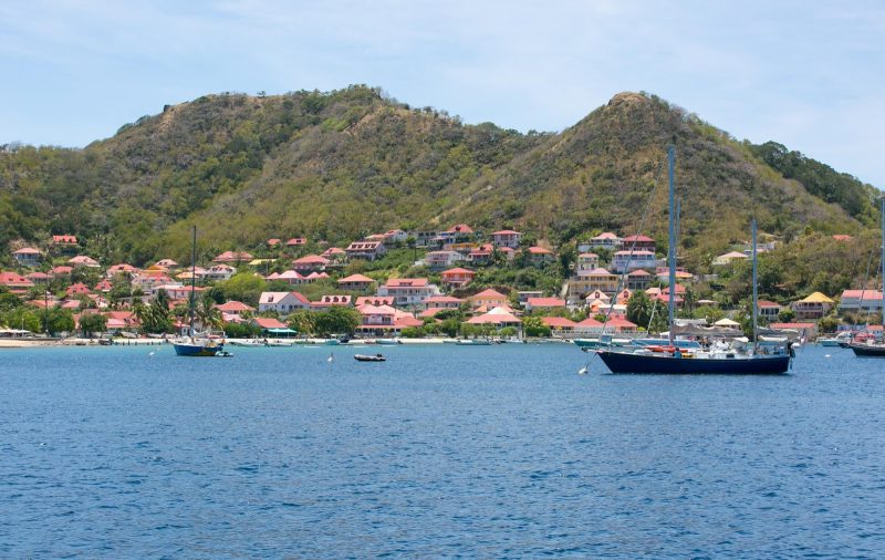 Pretty red-tiled houses line the waterfront of Îles des Saintes, Guadeloupe.