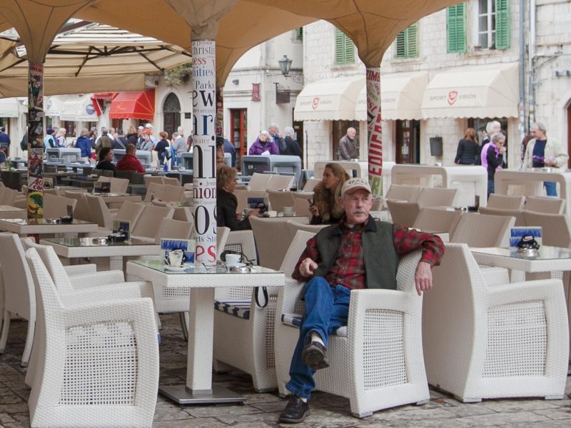 A patron relaxes at Caffe Bar Forza in Kotor's Old Town.