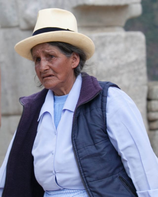 A Peruvian woman in traditional garb at Machu Picchu.