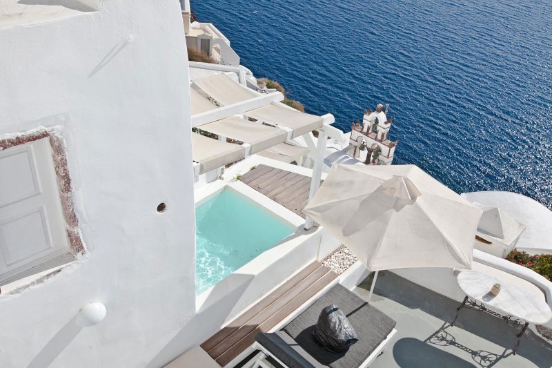 A pool with a view of the Aegean Sea in Oia on the Greek island of Santorini.