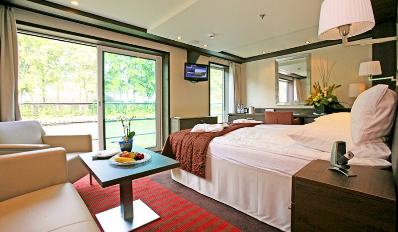Wake up to a beautiful view of Europe sailing past your suite's French balcony on Avalon Creativity.