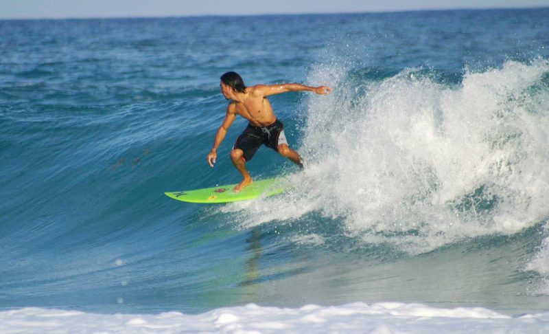 Surfers enjoy the wicked waves and laid-back style of Cozumel.