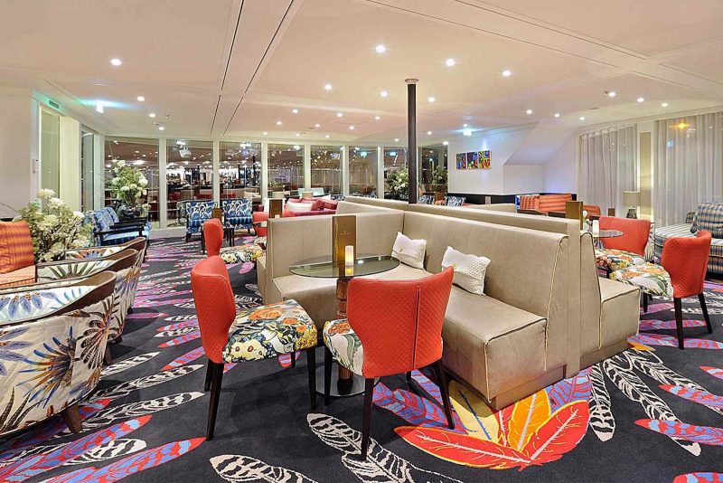 Enjoy the bright, airy Main Lounge during your AmaWaterways sailing.