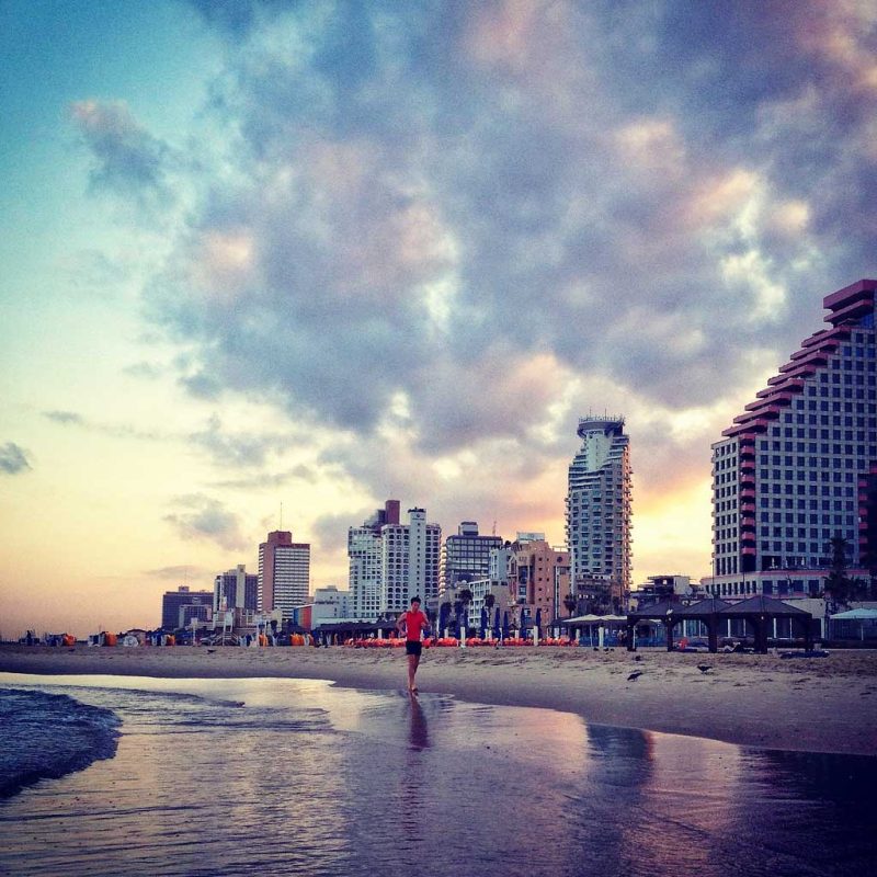 Sunset on the beach in Tel Aviv, Israel.