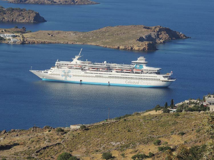 Celestyal Olympia anchored in the harbor.