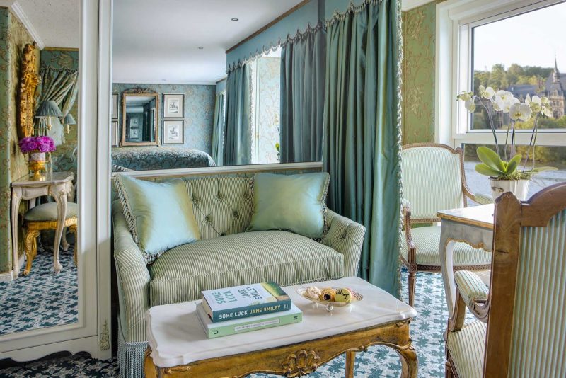 The roomy living room of a suite on Uniworld's S.S. Maria Theresa.