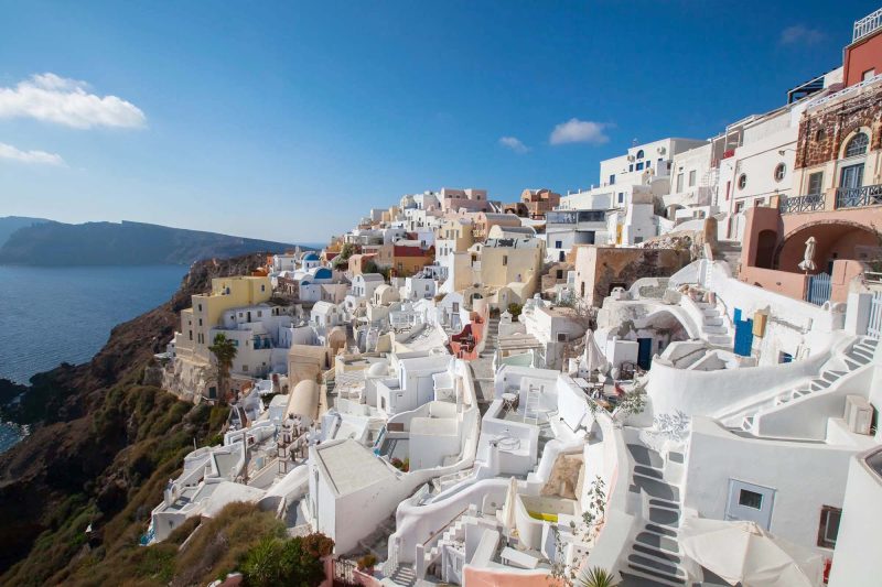 Captivating sugar-cube buildings line the cliffs of Oia on Santorini, Greece — one of the great views in the world.