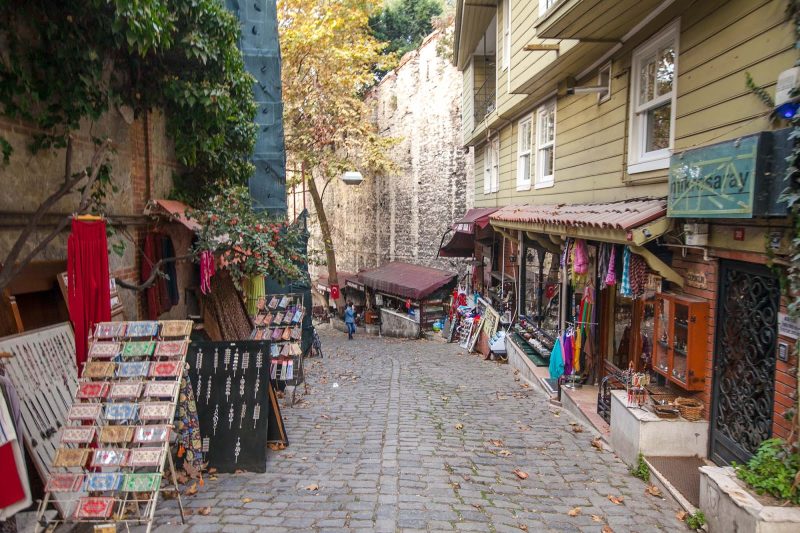 A quiet cobblestone street with shops selling keepsakes in Istanbul.