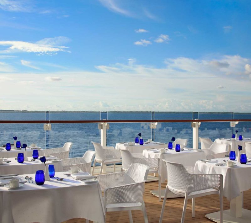 Enjoy al fresco dining on the terrace of Blu restaurant on Celebrity Apex.