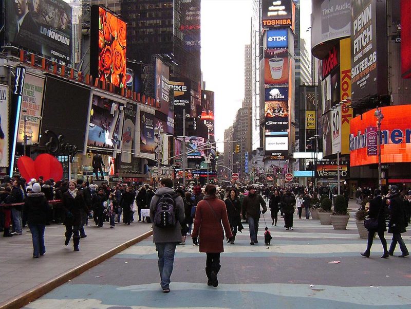Broadway and Times Square in Manhattan teems with pedestrians.