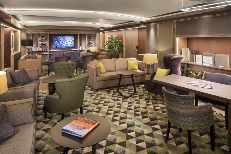Kick back during your vacation in the Neptune Lounge of Holland America's ms Koningsdam.