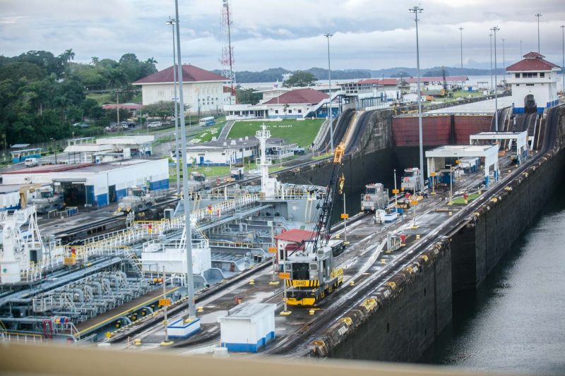 A cargo ship in the left locks begins a transit of the Panama Canal.
