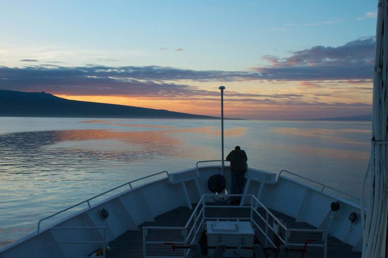Dawn breaks over the deck of the National Geographic Endeavour on a Lindblad expedition to the Galapagos.