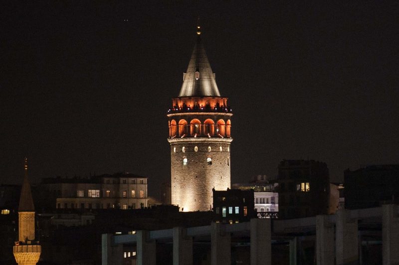 Galata Tower, a medieval stone tower in the Galata/Karaköy quarter of Istanbul, at night. Shot taken from aboard Viking Star.