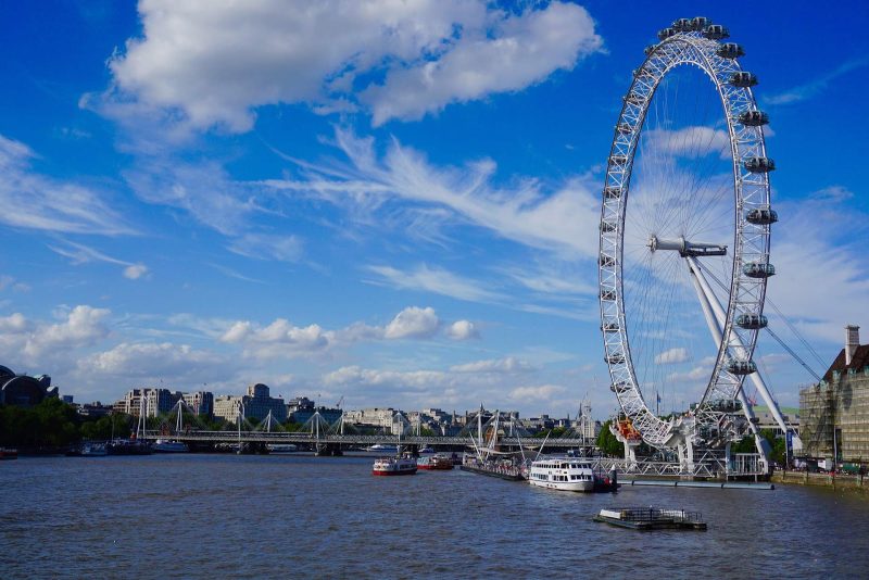 The London Eye, 443 feet tall, on the banks of the River Thames in London.