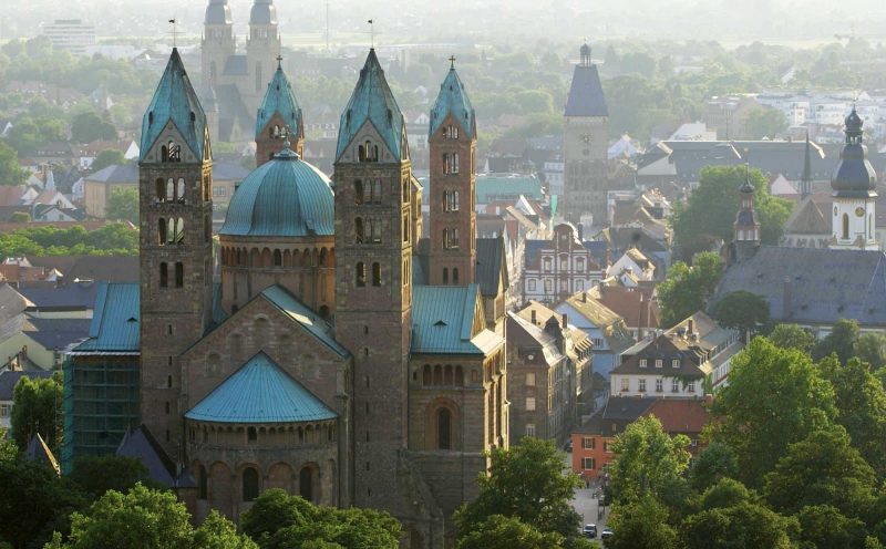 A view of historic Speyer Cathedral and surrounding rooftops in Speyer, Germany.