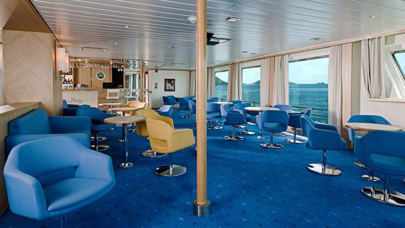 After a day exploring the Galapagos, relax in the spacious lounge aboard La Pinta.