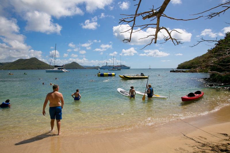Windstar passengers take advantage of kayaks, watercraft and other sports equipment during a beach barbecue in St. Lucia.