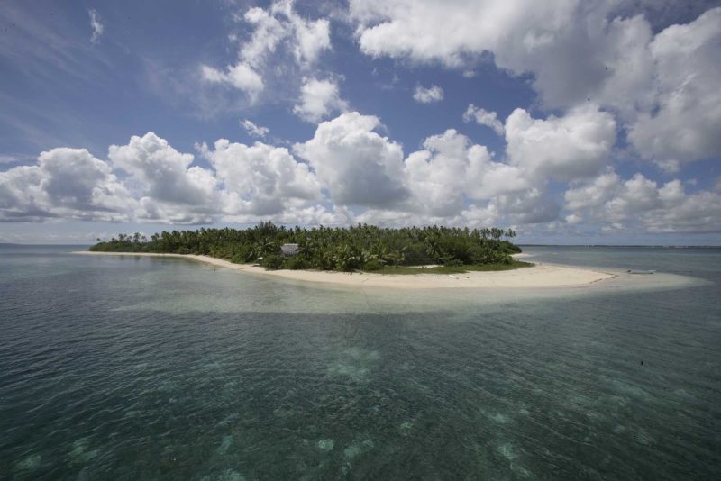 Light clouds over a Tongan island offer relief from the strong tropical sun.
