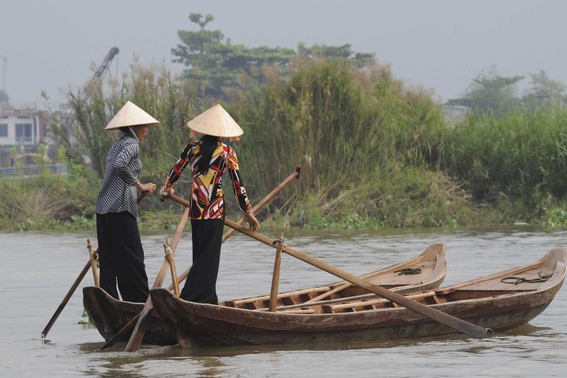 Traverse the canals of Hoi An, Vietnam, on a Ponant cruise.