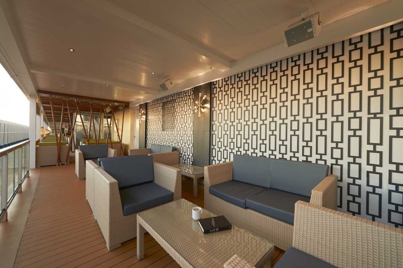 Check out the Lanai on Carnival Panorama. It’s an outdoor promenade that includes tables and chairs for casual dining.