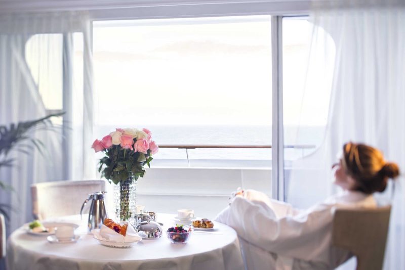 Wake up in a new port and order room service (it's complimentary) on Oceania's Sirena.