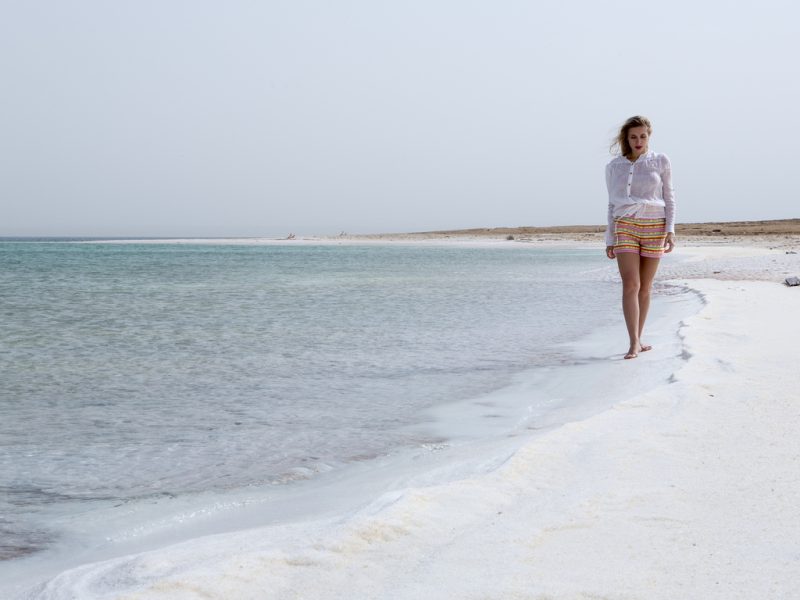 Walking along the shore of the Dead Sea.