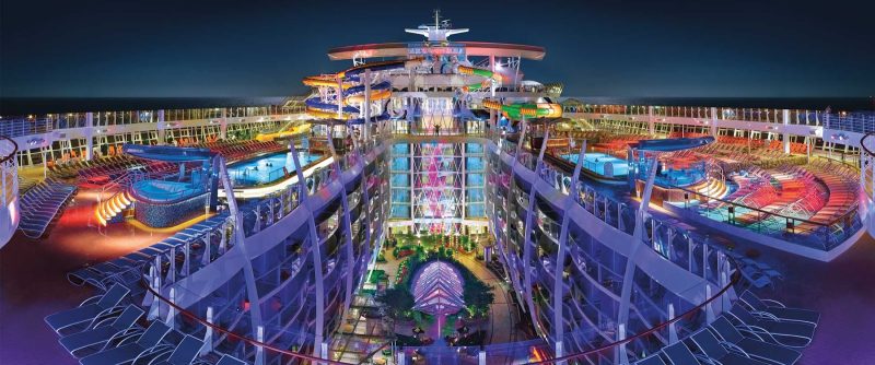 A view of the colorful top deck at night aboard Harmony of the Seas.