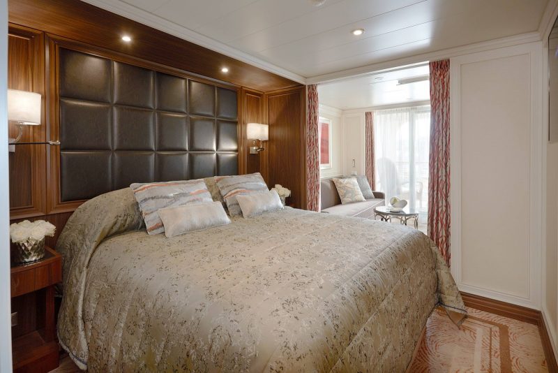 At 307 total square feet, the Veranda Suite on Seven Seas Explorer features a bedroom with king-size bed, marble bathroom, sitting area and private balcony.