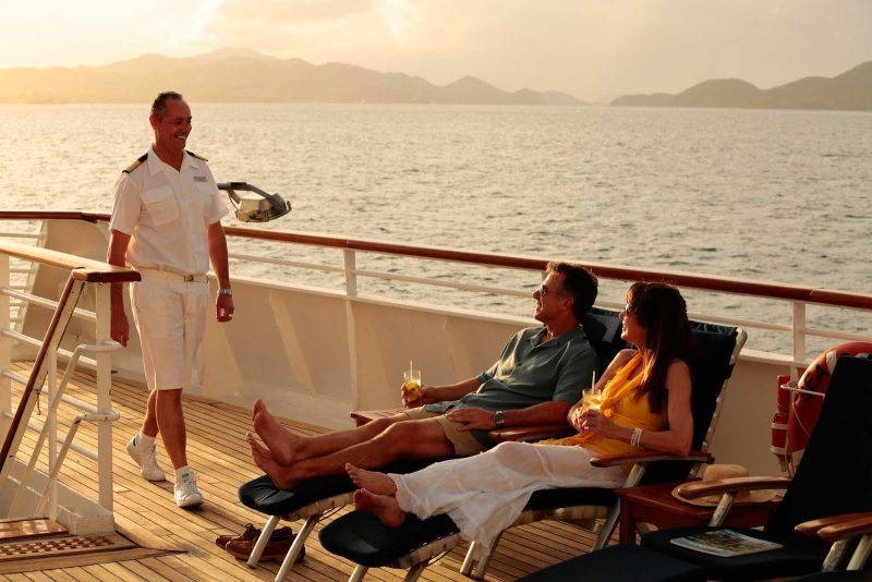Sunset is a good time to kick back and socialize with the crew on a SeaDream cruise.