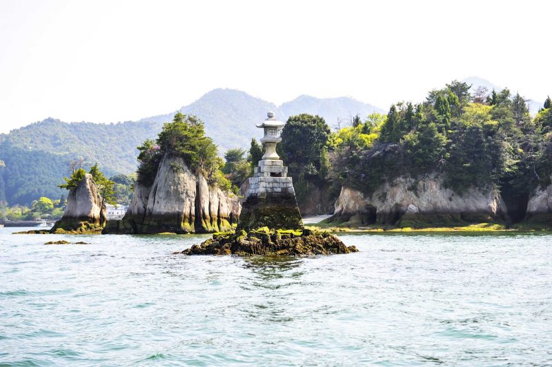 Sail to Miyajima, a small island with ancient temples in Hiroshima Bay, Japan.